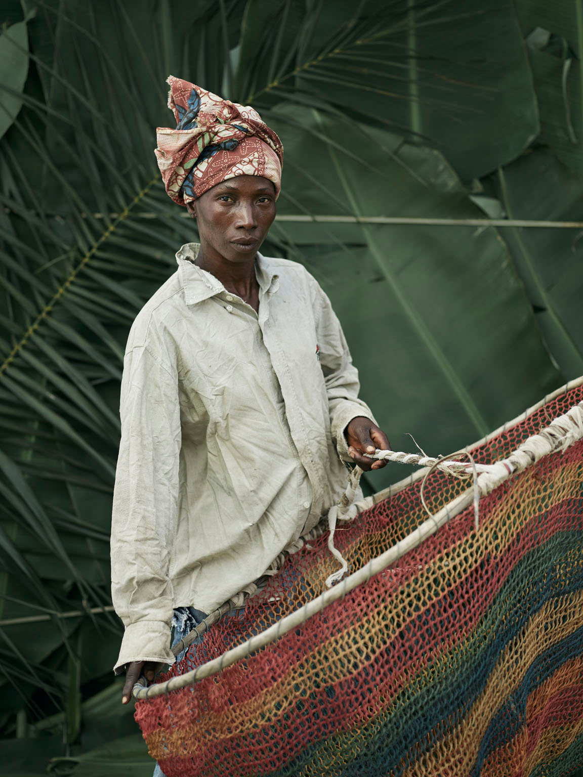 Massa Kenie, holding home-made hooped nets